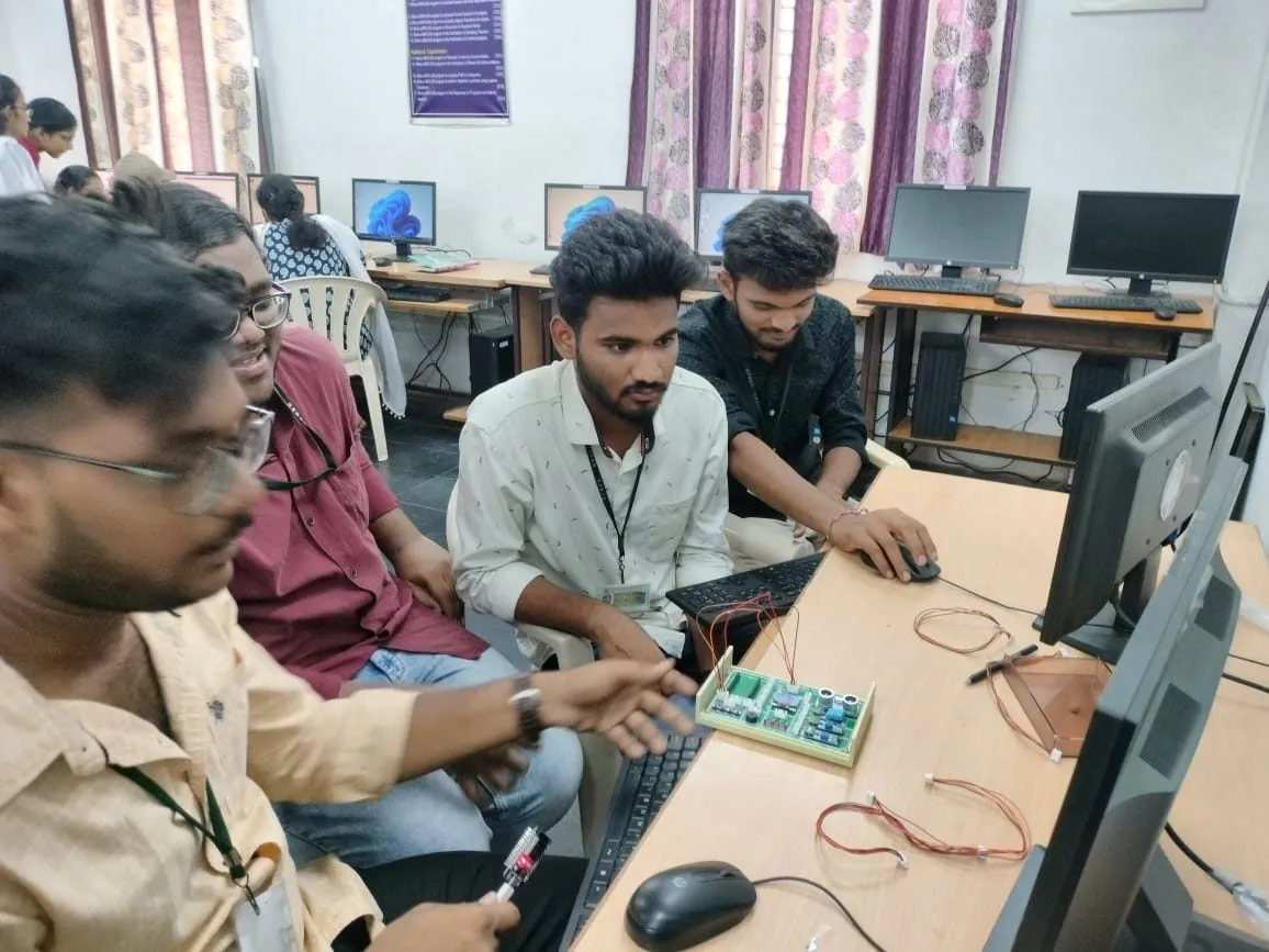 Students working in pairs on an IoT trainer kit in a lab