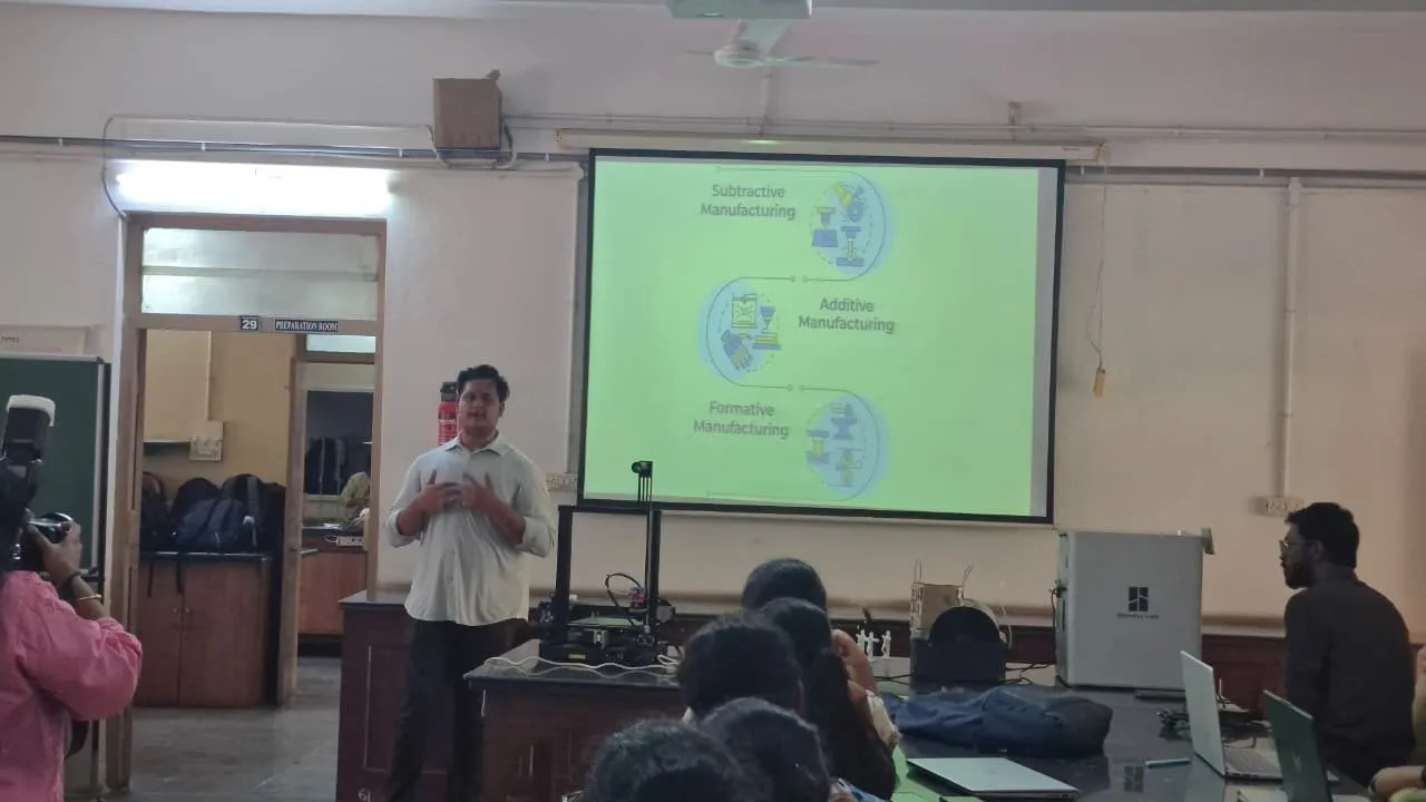 An instructor presenting a slide on additive manufacturing